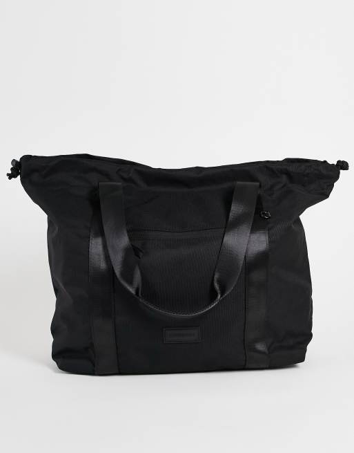 Consigned drawstring tote bag in black | ASOS