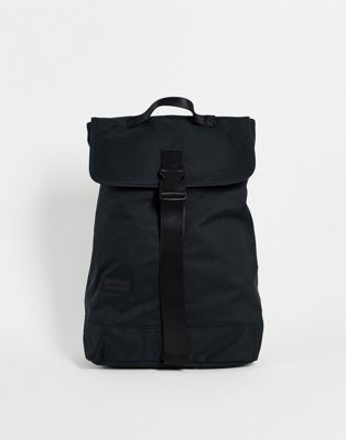 Consigned flap over backpack in black