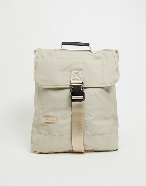 Consigned flap over backpack in stone