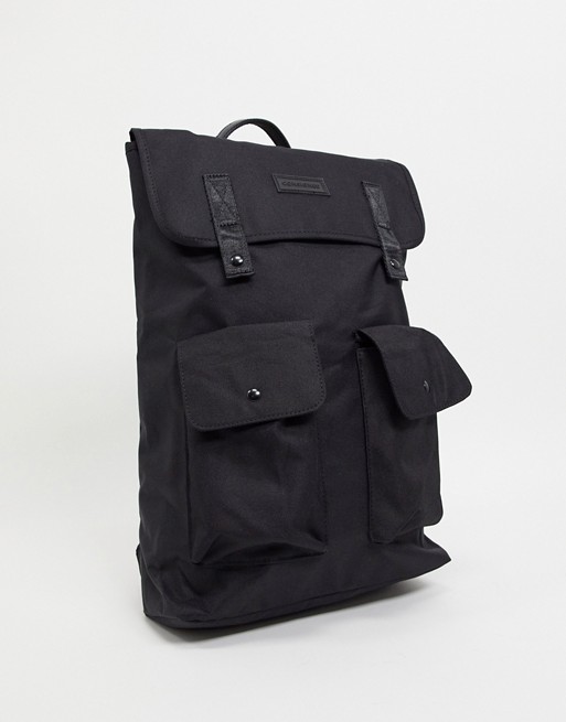 Consigned flap over backpack