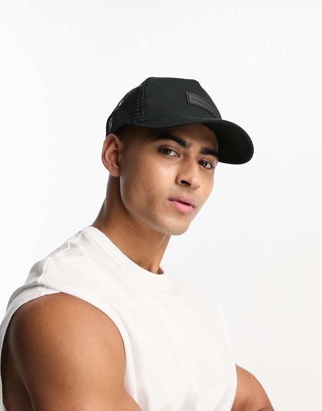 Consigned mesh trucker cap in black