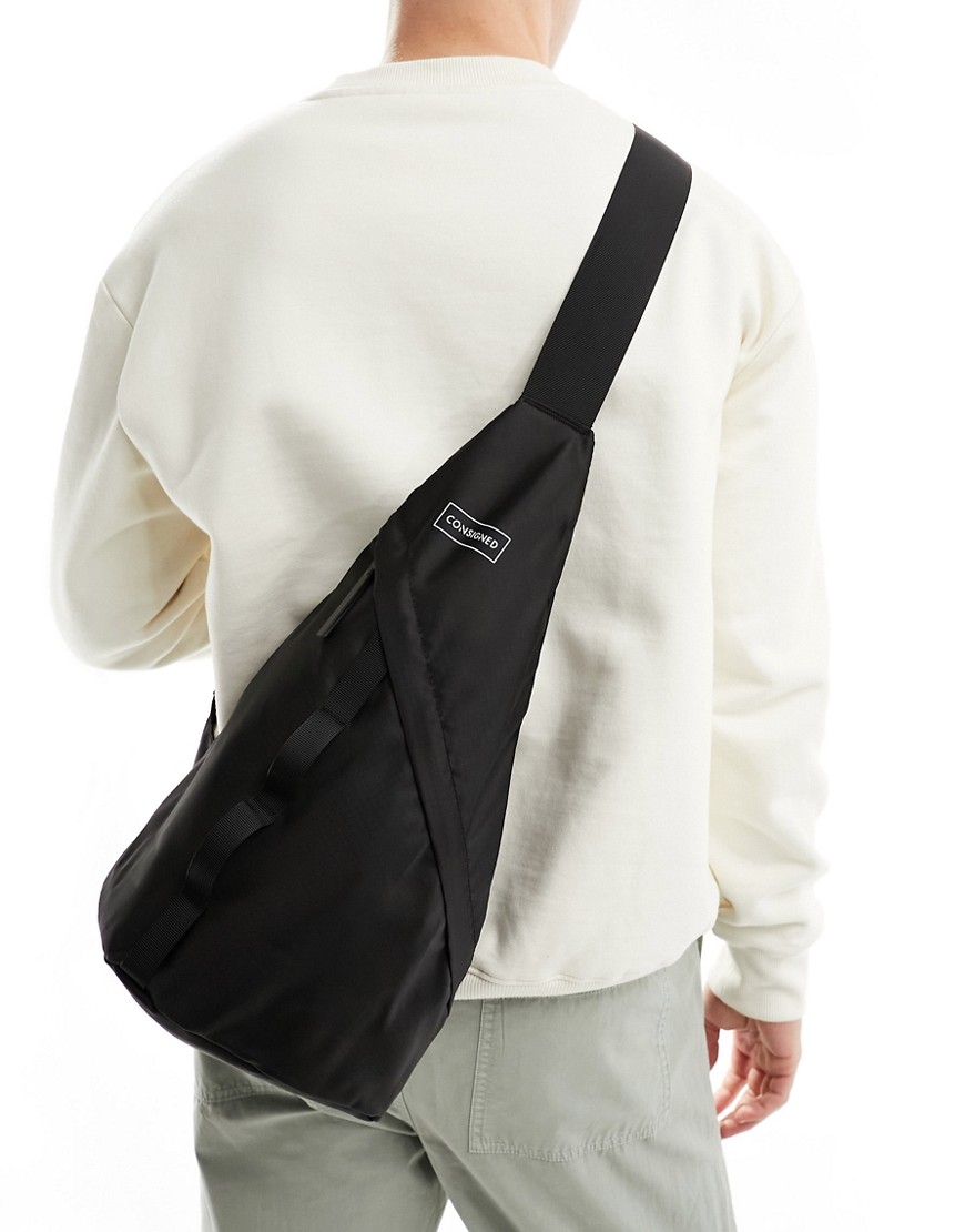 Consigned sling bag in black