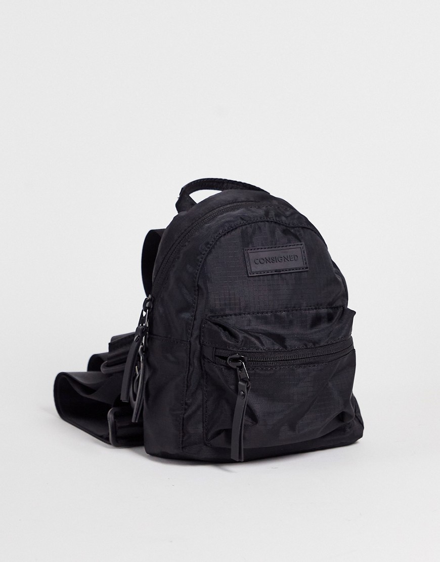 Consigned small zip round pocket backpack in black
