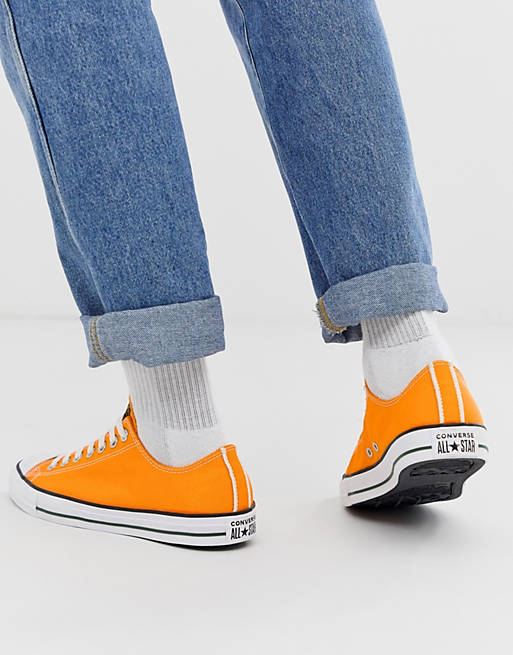 Converse All Star low Chuck Taylor plimsolls in yellow | ASOS