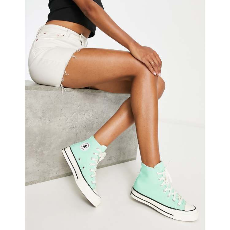 green sneakers converse