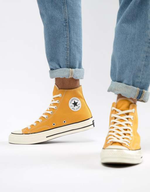 black and yellow leather converse