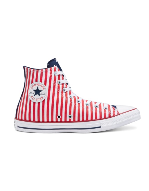 White converse with blue and store red stripe