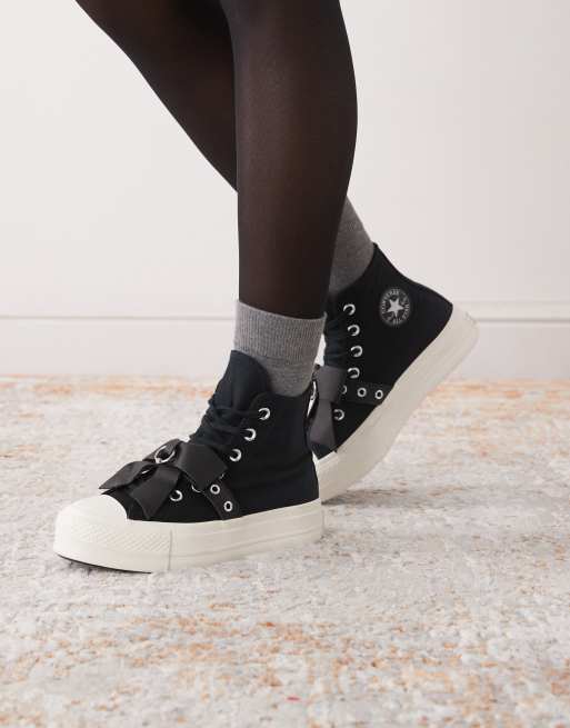 Converse Chuck Taylor All Star Hi Lift trainers in black with bows