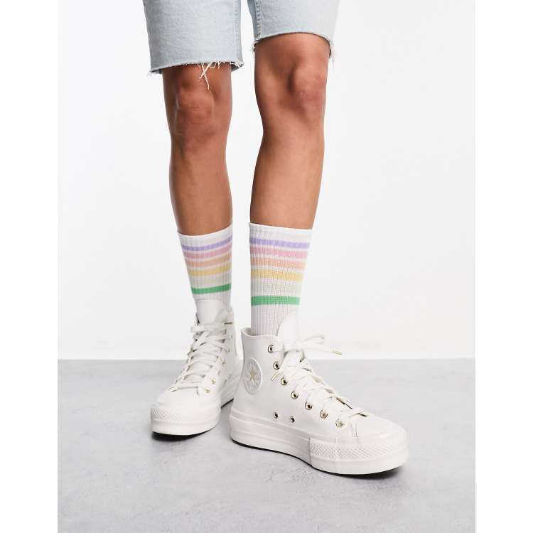 Converse blanche hot sale bout doré