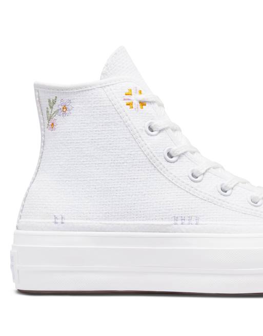 White converse with on sale flowers