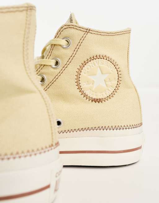 Cream and store gold converse