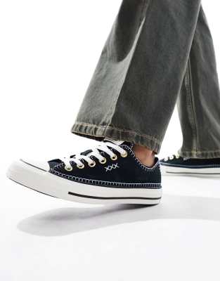 Chuck Taylor All Star Ox sneakers with crafted stitching in black and white