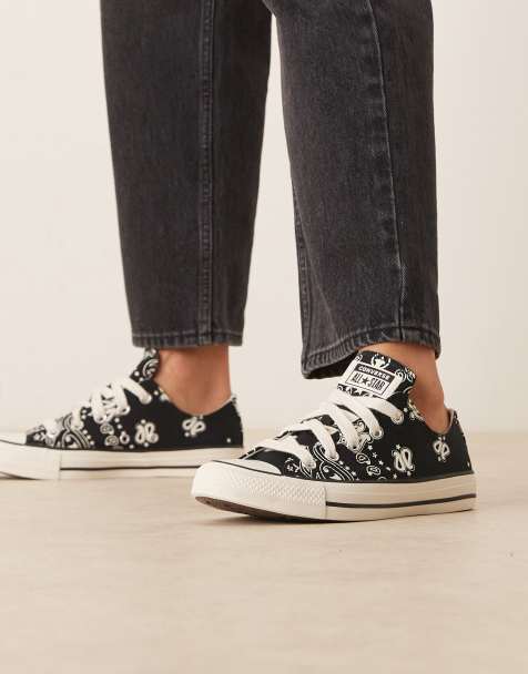 Converse Chuck Taylor All Star Ox trainers in black with white flower detail - view 1