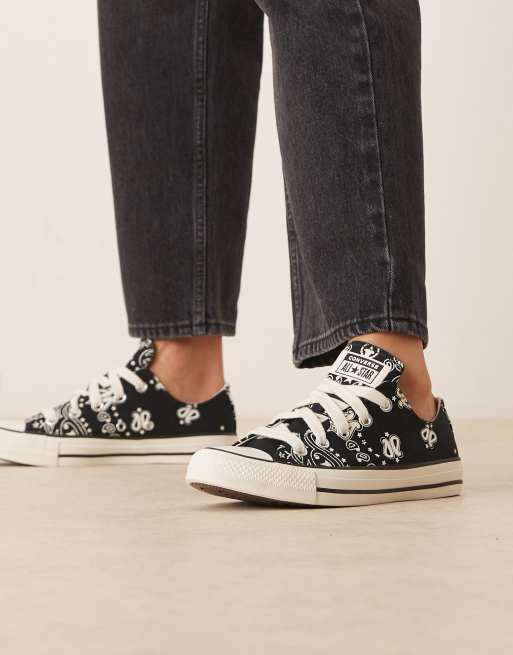 Converse Chuck Taylor All Star Ox trainers in black with white flower detail