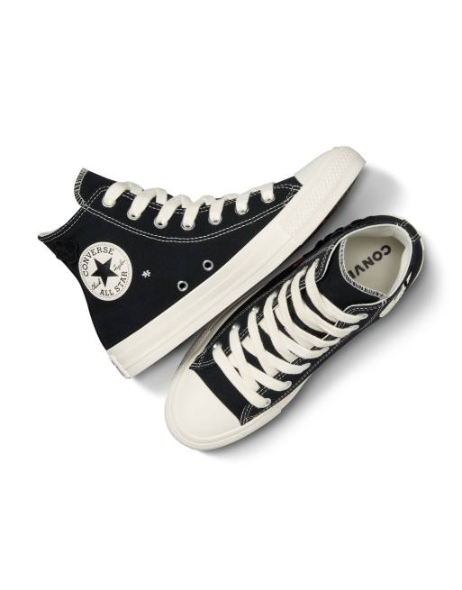 Converse Chuck Taylor All Star sneakers with flower