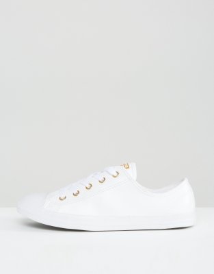 white converse with gold eyelets