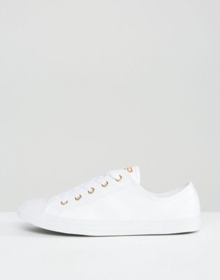 white converse with gold eyelets