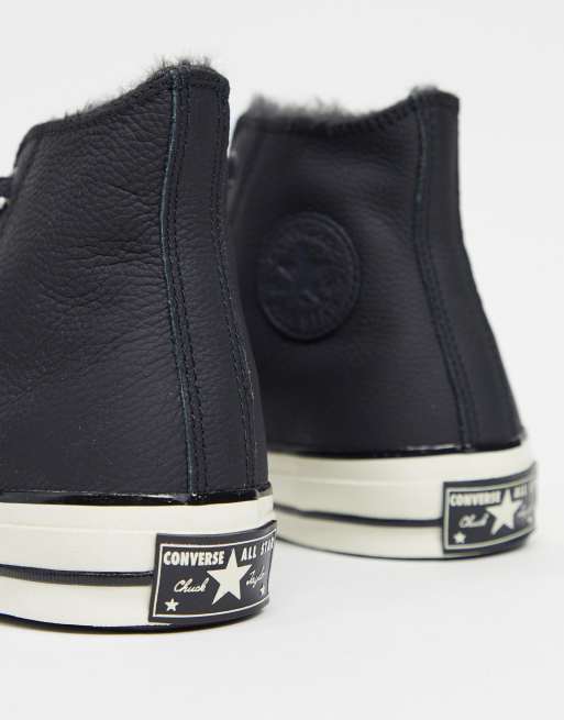 Black leather converse with shop fur