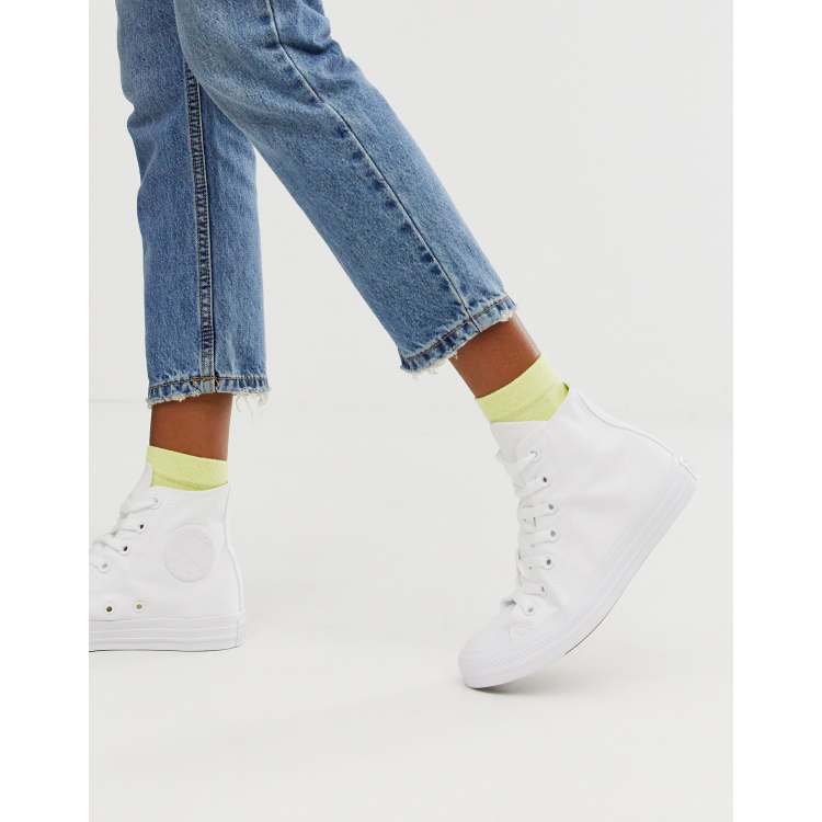 wearing white high top converse