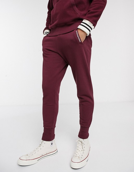 Converse Made in Italy reverse fleece logo cuffed joggers in burgundy ...