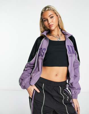 Málaga, Nuevo Cortavientos Con Los Colores Blanco, Verde Y Morado