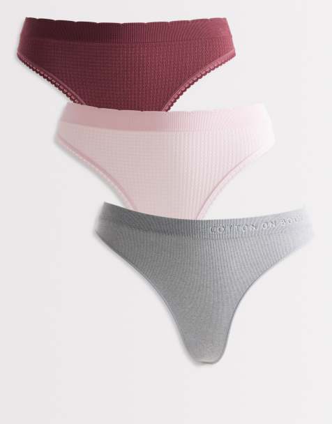 Cotton On – 3er-Pack nahtlose G-Strings in Rosa, Burgunderrot und Grau mit hohem Beinausschnitt - view 1