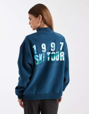Cotton On Plush Mock Neck Sweatshirt With Ski Tour Graphic In Blue
