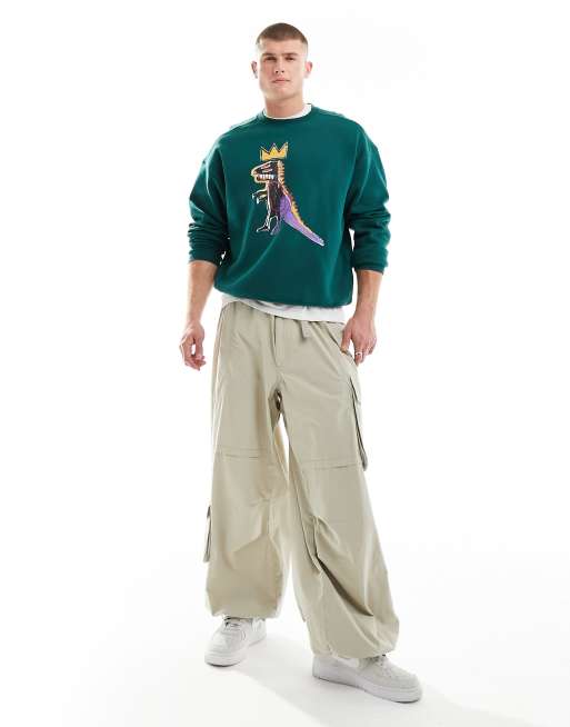 Cotton On relaxed sweatshirt with Basquiat dinosaur graphic in evergreen 