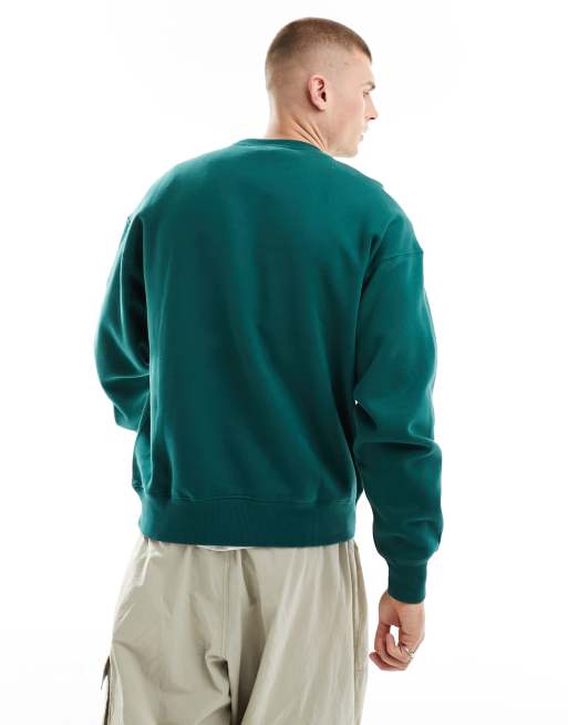 Cotton On relaxed sweatshirt with Basquiat dinosaur graphic in evergreen 