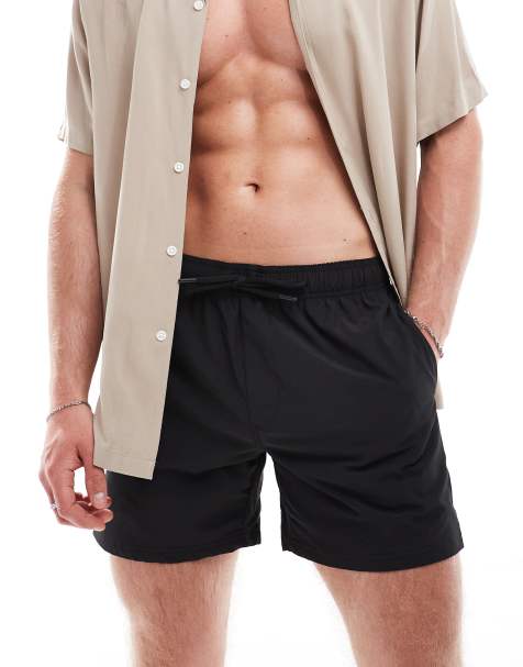 Cotton On stretch swim shorts in black - view 1