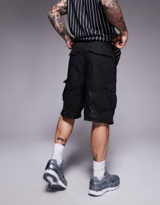 Courtside baggy distressed cargo shorts in black camo