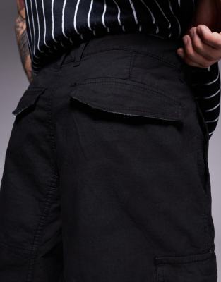 Courtside baggy distressed cargo shorts in black camo