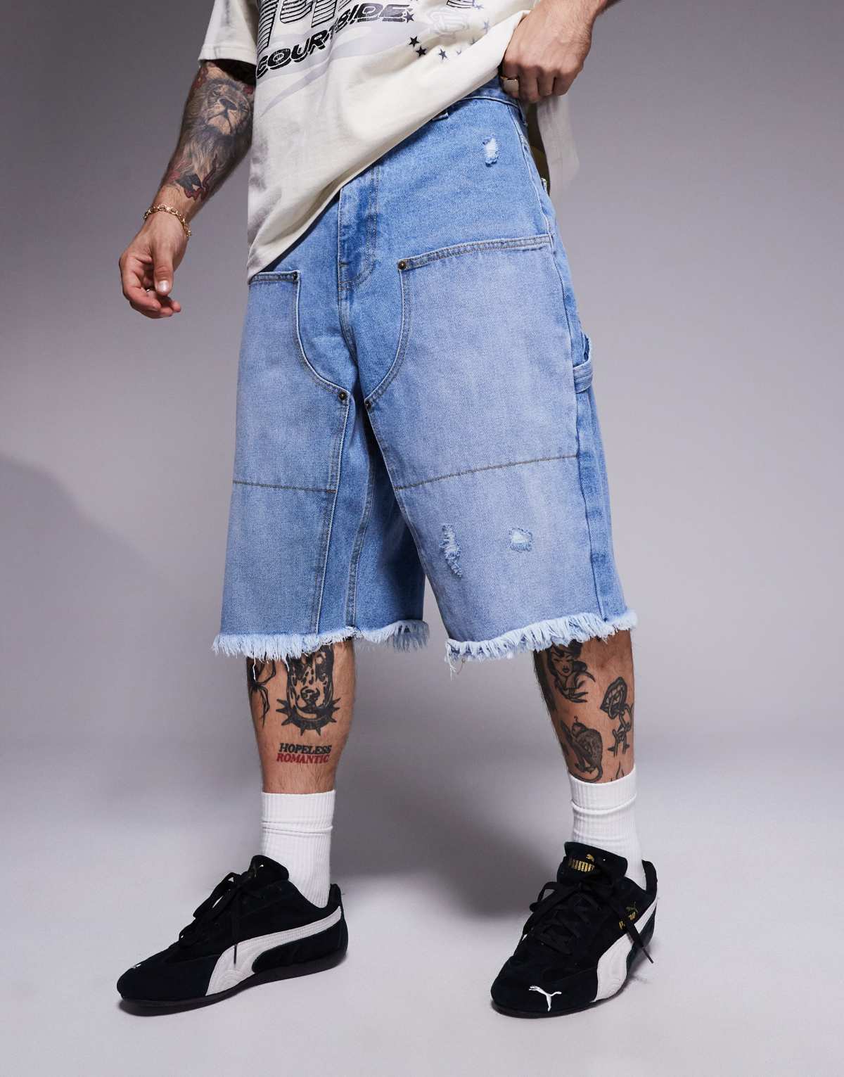 Courtside distressed denim carpenter jort in washed blue