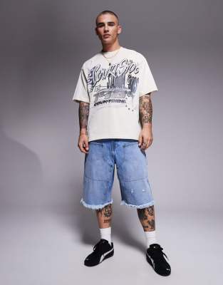 Courtside distressed denim carpenter jorts in washed blue
