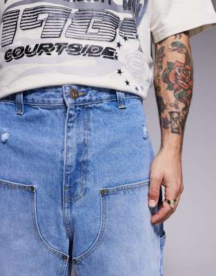 Courtside distressed denim carpenter jorts in washed blue