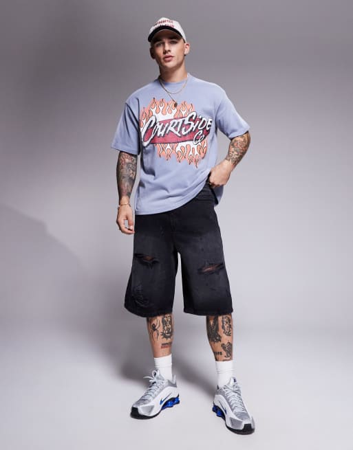 Courtside extreme distressed denim jorts in washed black