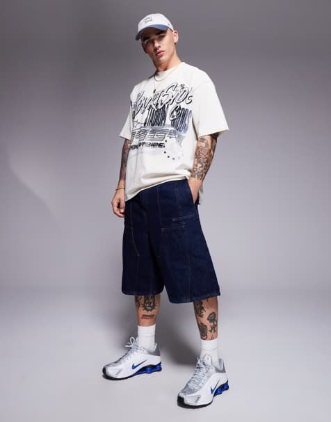 Courtside - Indigoblå jorts med panelsyninger og logobroderi på baglommen i denim - view 1