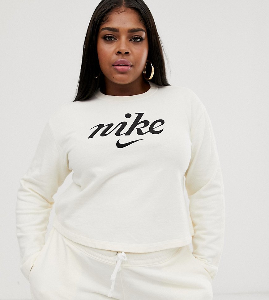 Cremefarvet croppet sweatshirt fra Nike Plus