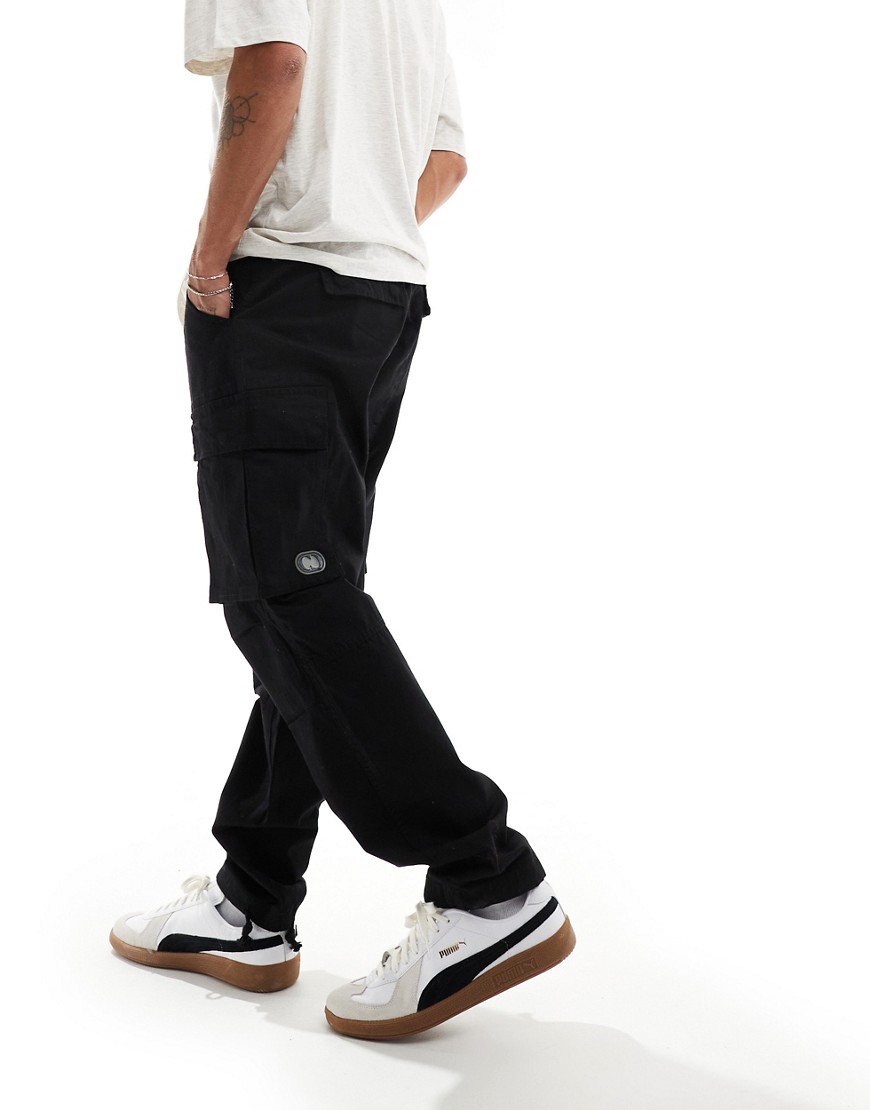Criminal Damage cargo pants with side leg army pockets in black