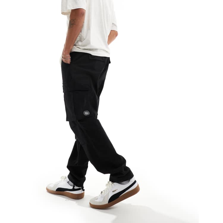Criminal Damage cargo pants with side leg army pockets in black  