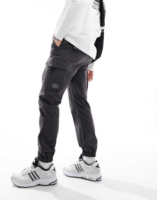 Criminal Damage cargo pants with side leg army pockets in charcoal