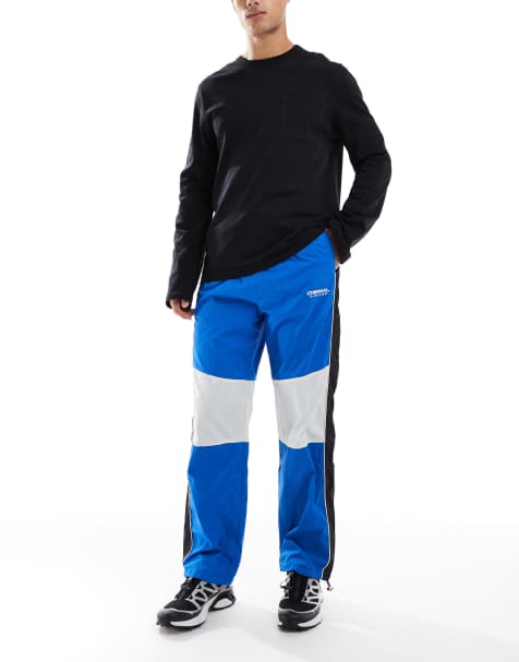 Criminal Damage colour block track pants in blue - view 1