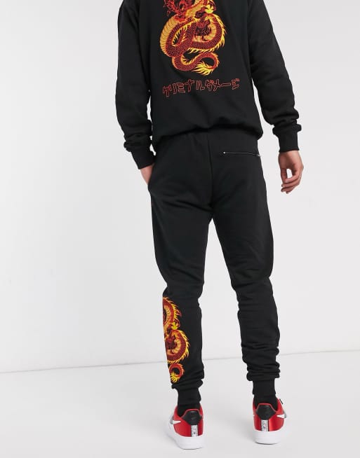 Criminal Damage dragon embroidered jogger in black ASOS