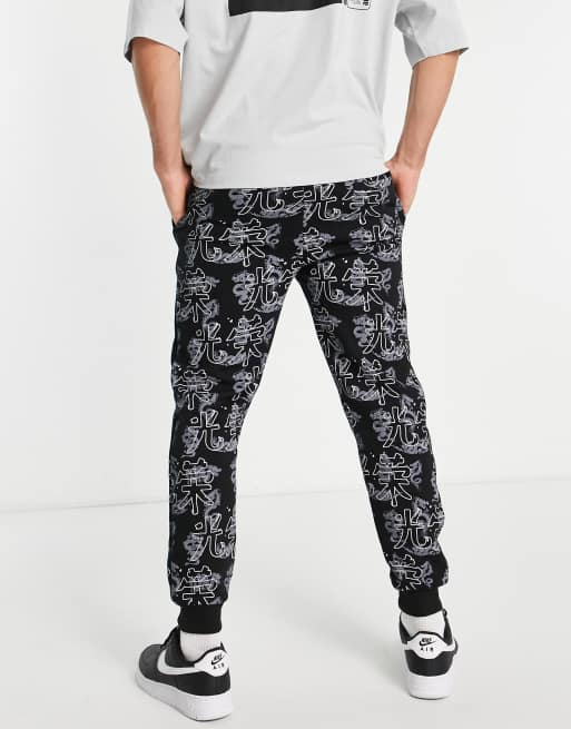 Criminal Damage – Jogginghose in Schwarz mit All-Over-Print, Kombiteil, 2 von 4