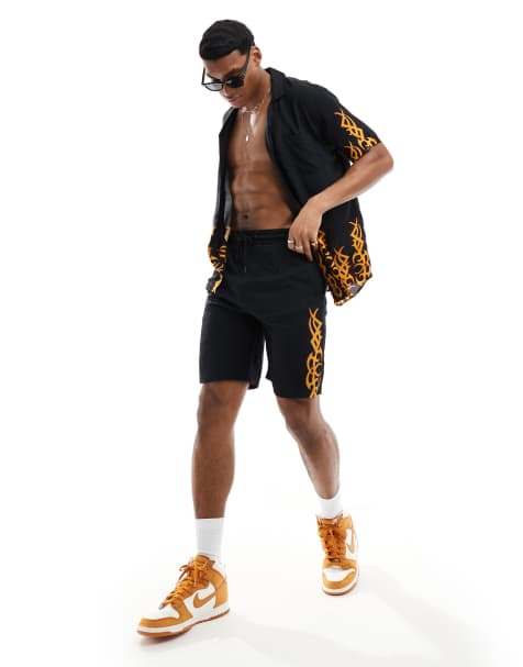 Criminal Damage print shorts in black & multi - view 1