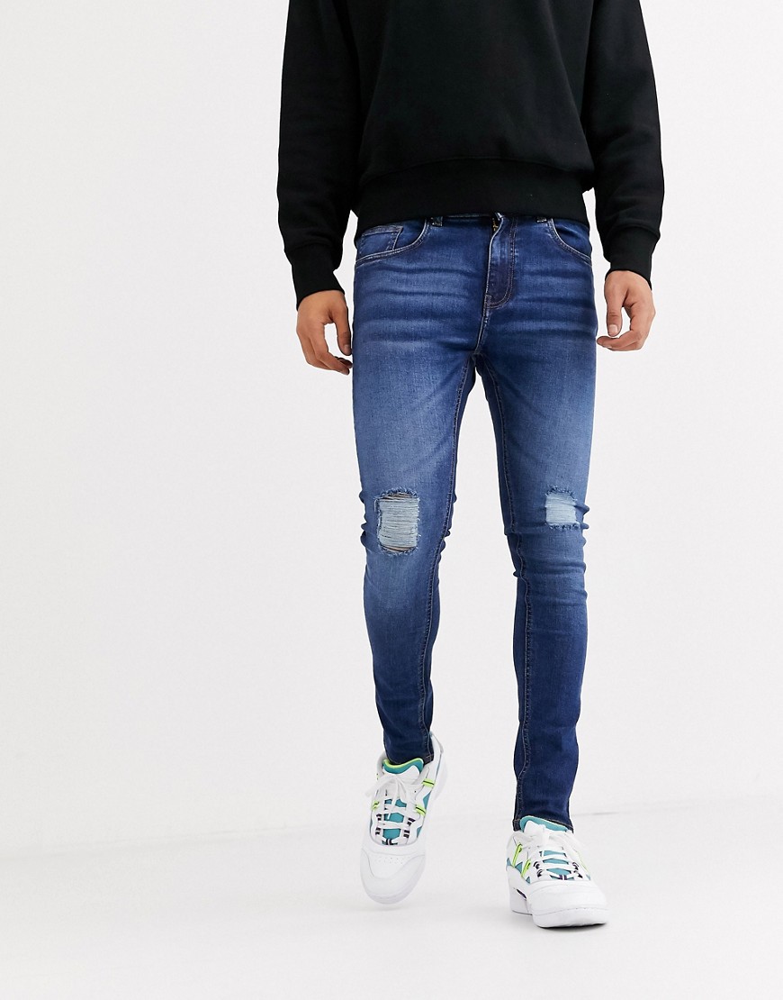 Criminal Damage - Skinny jeans in middenblauwe wassing met slijtageplekken