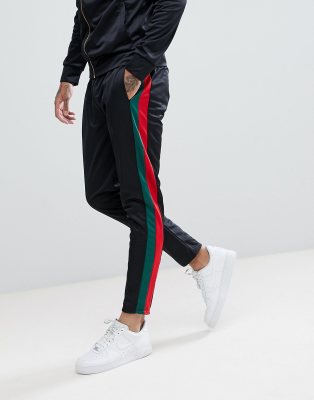 black adidas joggers red stripes