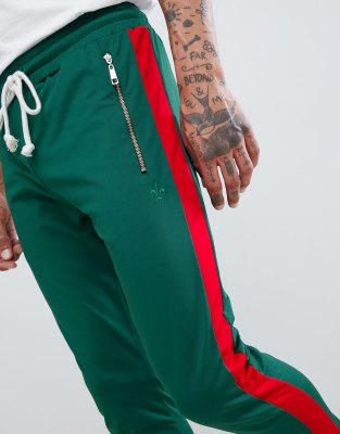 green sweatpants with red stripe