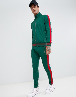 green sweatpants with red stripe