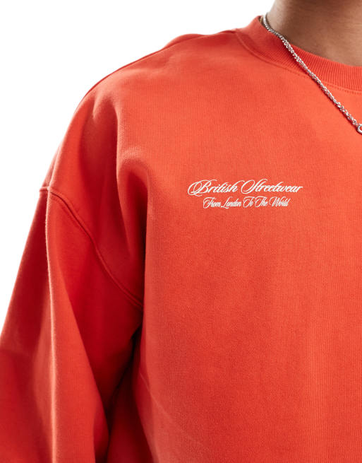 Criminal Damage Spray varsity sweatshirt in washed red ASOS